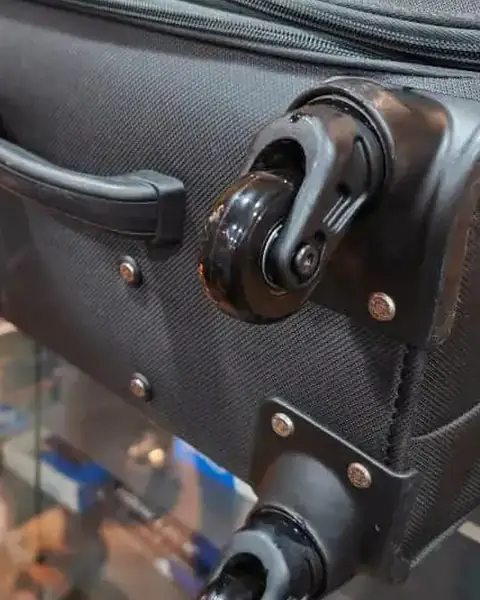 The same suitcase with a new spinner wheel fitted