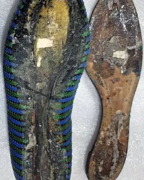 Ballet flat with the sole worn away, before repair