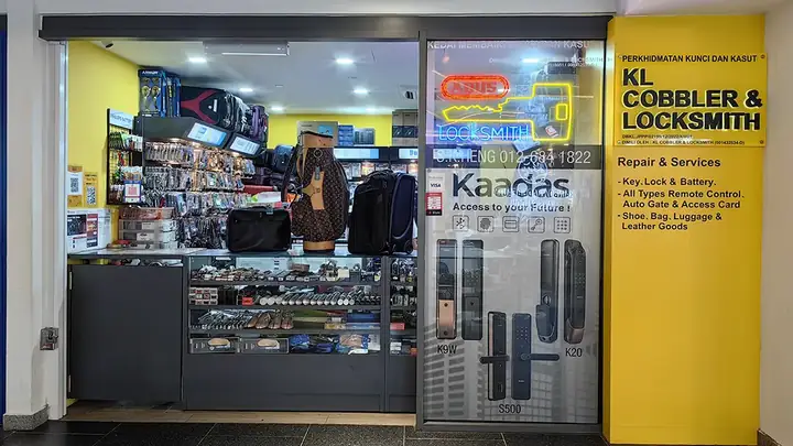 The yellow KL Cobbler & Locksmith shopfront at lot B-05, basement 1, Pearl Point Shopping Mall